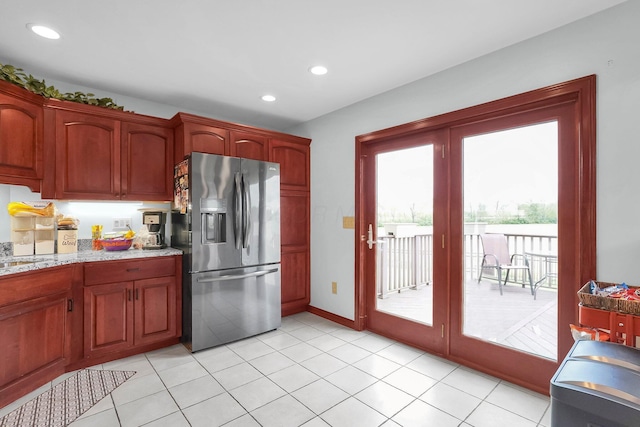 1574 Brooke Park Dr, Circleville, OH 43113 - kitchen with stainless steel fridge with ice dispenser, baseboards, light stone countertops, light tile patterned flooring, and recessed lighting