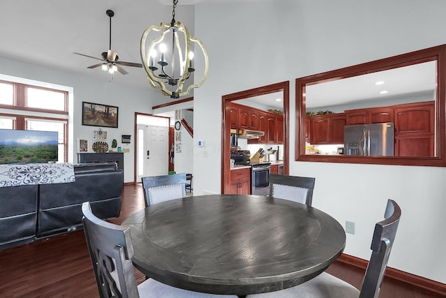 dining space with dark wood-style flooring, ceiling fan with notable chandelier, baseboards, and recessed lighting
