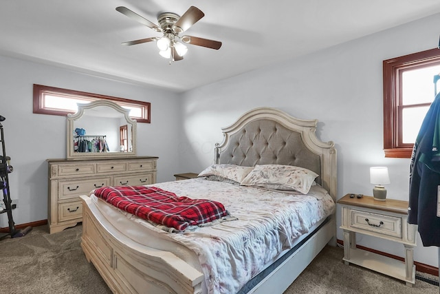bedroom with multiple windows, baseboards, and carpet floors