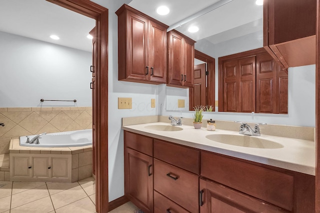 full bath featuring a sink, tile patterned flooring, double vanity, and a bath