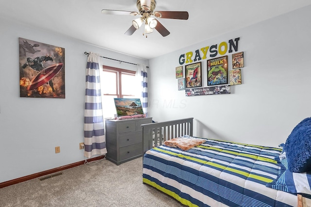 bedroom with ceiling fan, carpet, baseboards, and visible vents