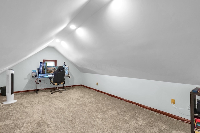 home office featuring baseboards, carpet, and vaulted ceiling