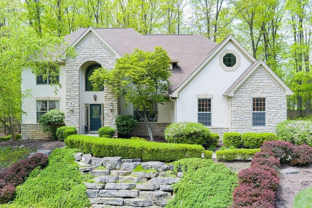 8884 Filiz Ln, Powell, OH 43065 - french country style house with stone siding and stucco siding