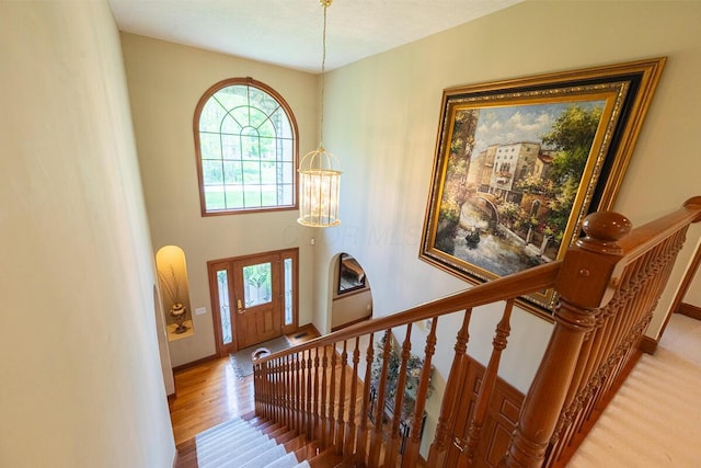 8884 Filiz Ln, Powell, OH 43065 - foyer entrance with light wood finished floors, baseboards, and stairs