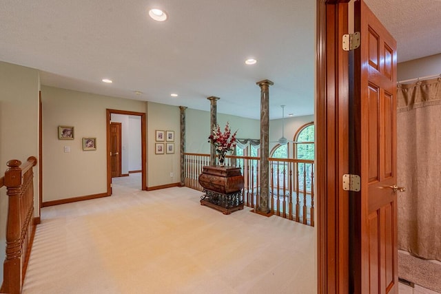 8884 Filiz Ln, Powell, OH 43065 - hall featuring light carpet, baseboards, recessed lighting, and an upstairs landing