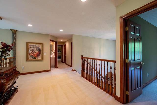 8884 Filiz Ln, Powell, OH 43065 - hallway with light colored carpet, recessed lighting, and baseboards