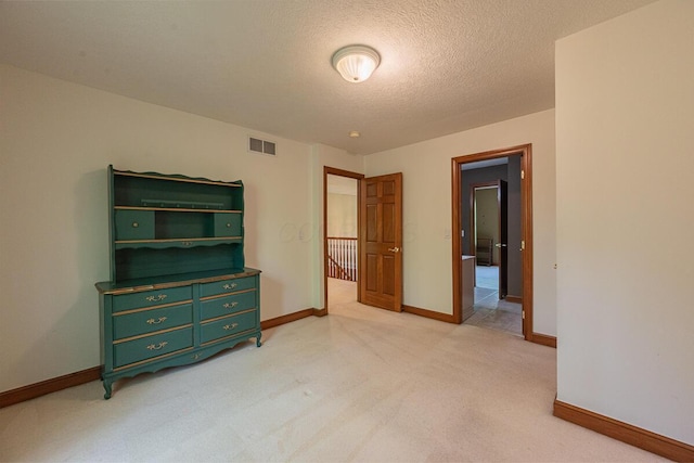 8884 Filiz Ln, Powell, OH 43065 - bedroom with a textured ceiling, baseboards, and light carpet