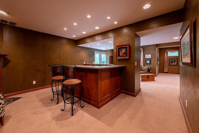 8884 Filiz Ln, Powell, OH 43065 - indoor dry bar featuring light colored carpet, recessed lighting, and baseboards