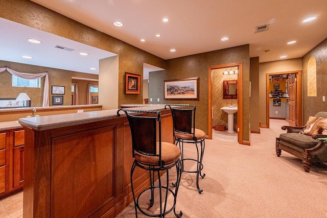 8884 Filiz Ln, Powell, OH 43065 - bar featuring recessed lighting, a sink, and light colored carpet