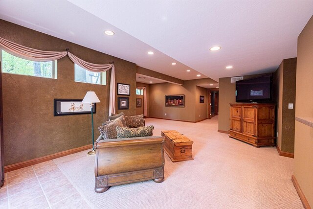 8884 Filiz Ln, Powell, OH 43065 - carpeted living area with recessed lighting and baseboards