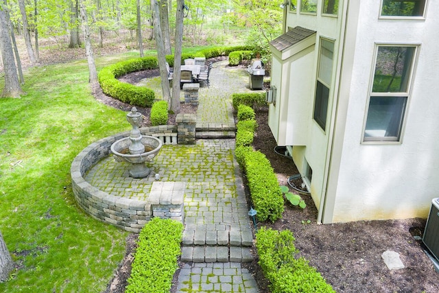 8884 Filiz Ln, Powell, OH 43065 - view of grassy yard featuring a patio