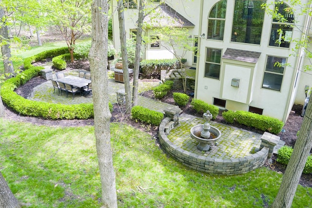 8884 Filiz Ln, Powell, OH 43065 - view of green lawn with a patio area