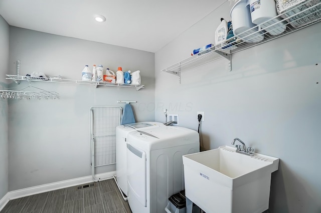 3781 Aviary Loop, Hilliard, OH 43026 - laundry area featuring a sink, separate washer and dryer, laundry area, visible vents, and baseboards