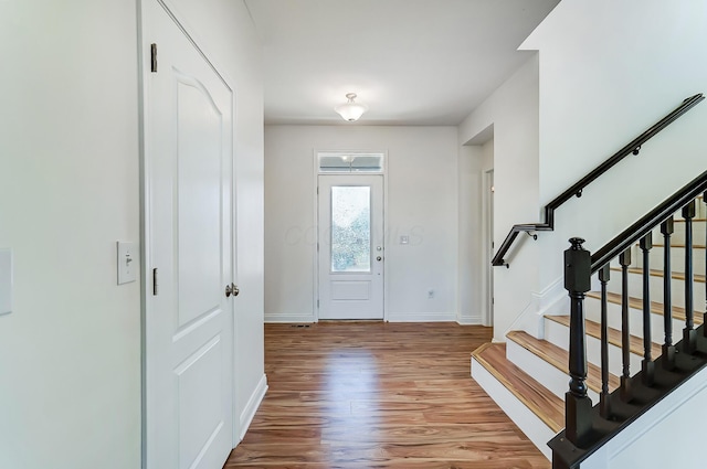 3781 Aviary Loop, Hilliard, OH 43026 - entryway featuring wood finished floors, baseboards, and stairs