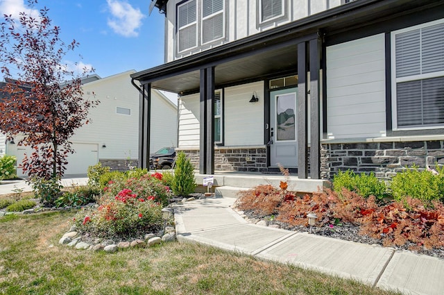 3781 Aviary Loop, Hilliard, OH 43026 - doorway to property featuring stone siding and covered porch