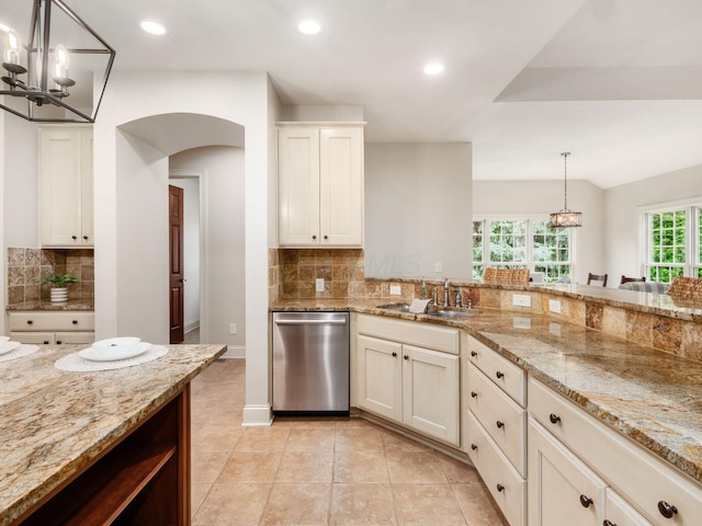 kitchen featuring dishwasher, a sink, a chandelier, tasteful backsplash, and recessed lighting