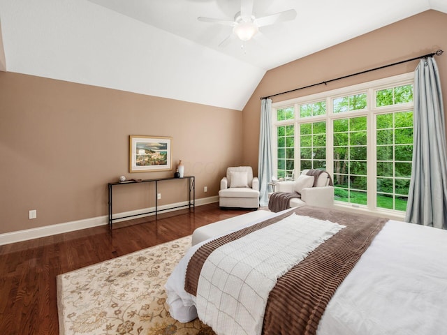 bedroom with vaulted ceiling, wood finished floors, baseboards, and ceiling fan