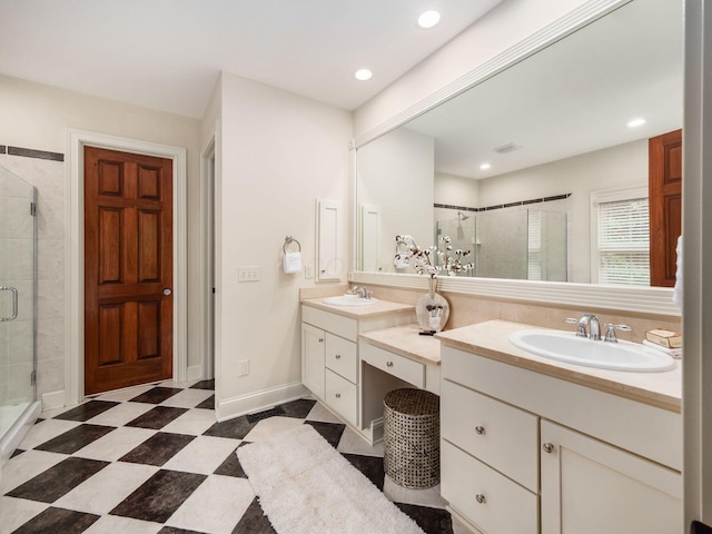 full bath featuring a stall shower, vanity, recessed lighting, and baseboards