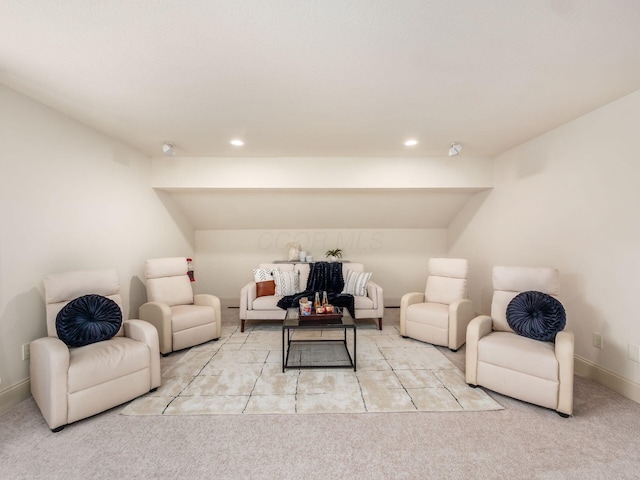 carpeted living room with recessed lighting and baseboards