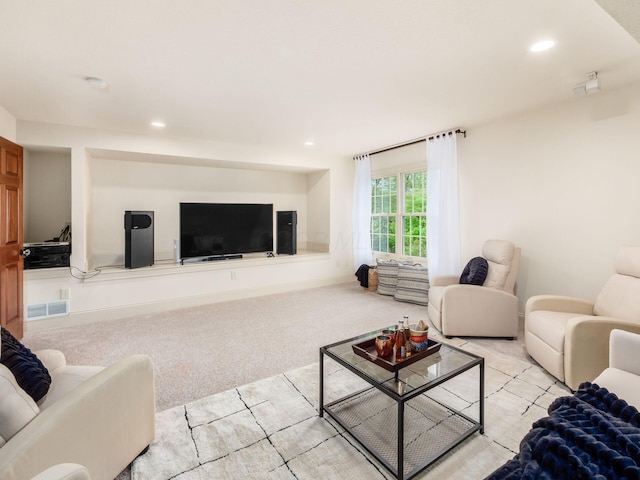 living room with carpet flooring and recessed lighting
