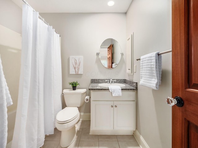 bathroom with tile patterned flooring, toilet, vanity, baseboards, and a shower with curtain