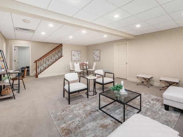 living room featuring carpet flooring, stairway, baseboards, and recessed lighting