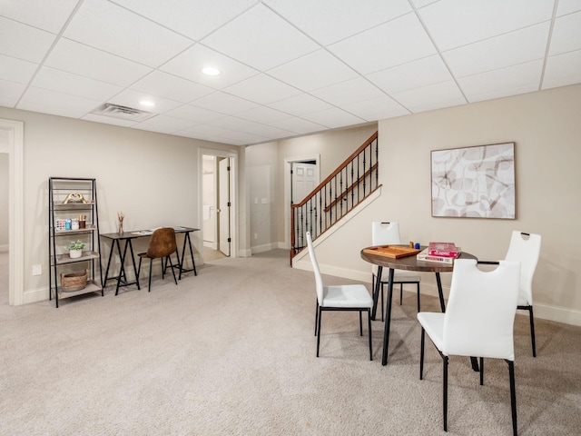 dining area featuring carpet flooring, a paneled ceiling, stairs, baseboards, and recessed lighting