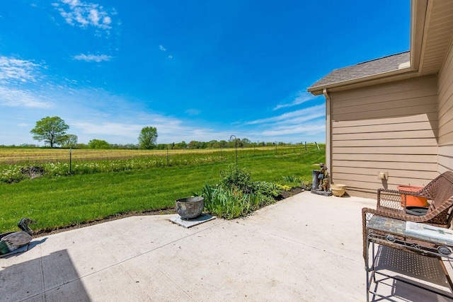 view of patio / terrace with a rural view