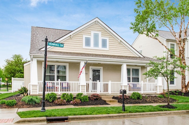 4703 Trumhall Dr, Grove City, OH 43123 - bungalow-style home featuring roof with shingles and covered porch
