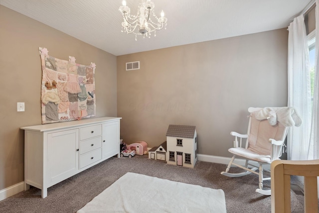 playroom featuring dark colored carpet, a notable chandelier, baseboards, and visible vents