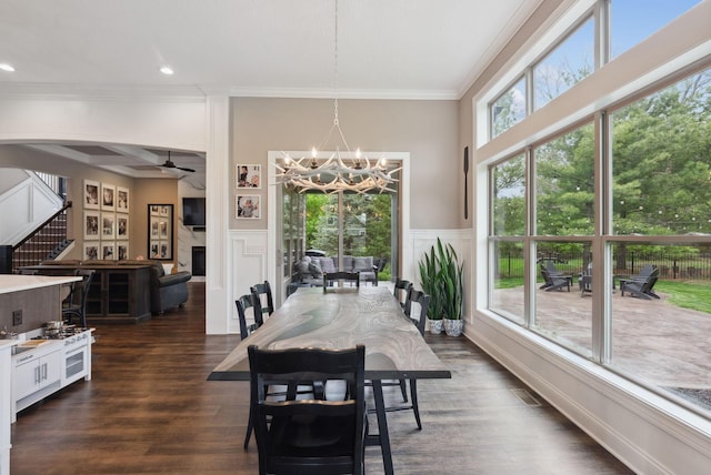 dining space featuring recessed lighting, crown molding, ceiling fan with notable chandelier, and dark wood-style floors