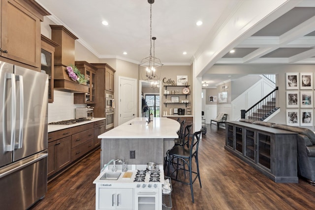 kitchen featuring glass insert cabinets, open shelves, a kitchen breakfast bar, light countertops, and appliances with stainless steel finishes