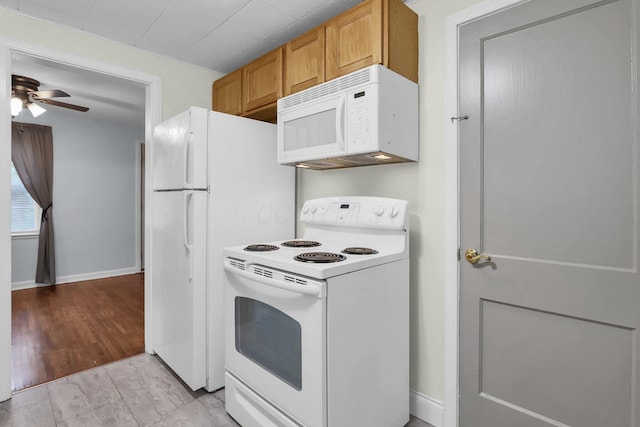kitchen featuring white appliances, a ceiling fan, light wood-type flooring, baseboards, and brown cabinetry