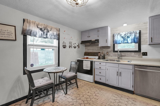 kitchen featuring dishwasher, electric stove, a sink, under cabinet range hood, and gray cabinets