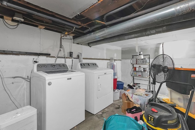 washroom with independent washer and dryer