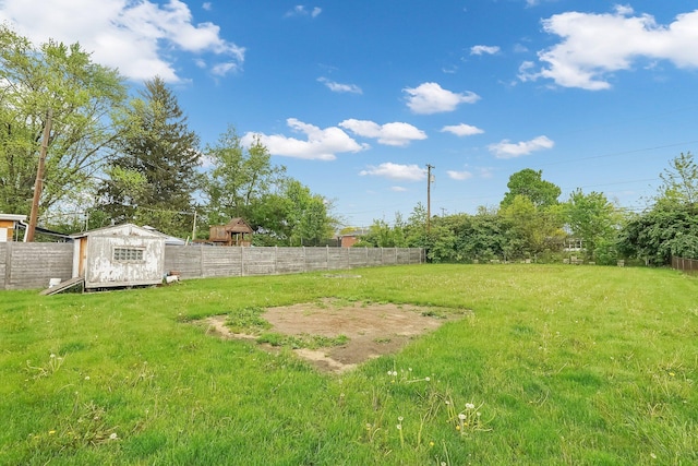 view of yard with a storage unit and an outbuilding