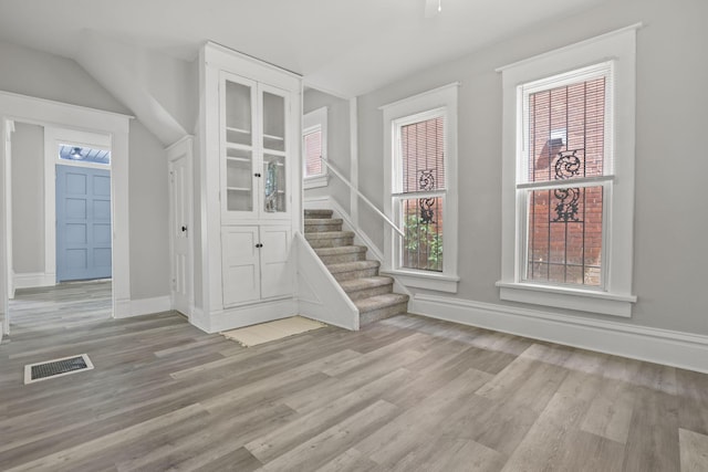 838 Wilson Ave, Columbus, OH 43206 - entryway featuring wood finished floors, stairway, and baseboards