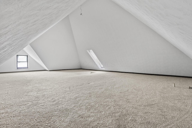 838 Wilson Ave, Columbus, OH 43206 - additional living space featuring vaulted ceiling, carpet floors, and a textured ceiling