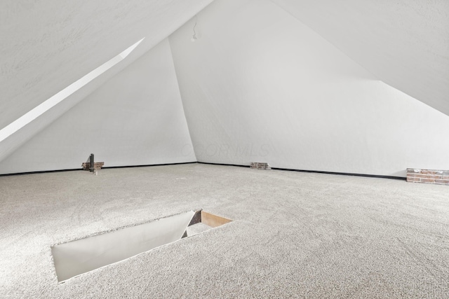 838 Wilson Ave, Columbus, OH 43206 - additional living space featuring carpet flooring and vaulted ceiling