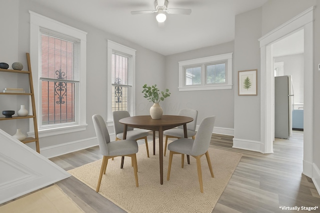 838 Wilson Ave, Columbus, OH 43206 - dining area with ceiling fan, baseboards, and wood finished floors