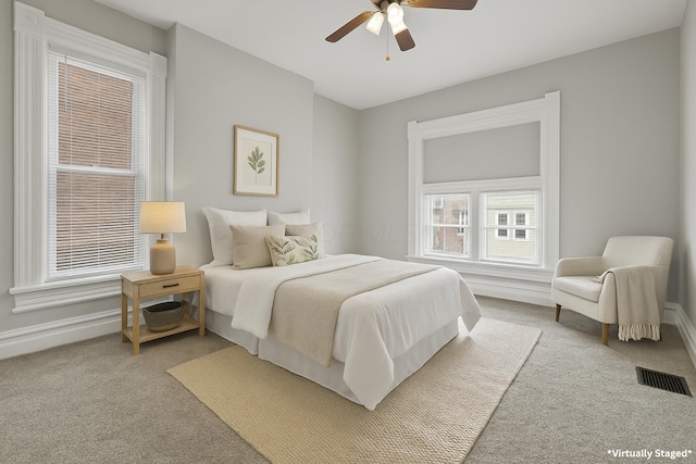 838 Wilson Ave, Columbus, OH 43206 - bedroom featuring carpet, baseboards, and a ceiling fan