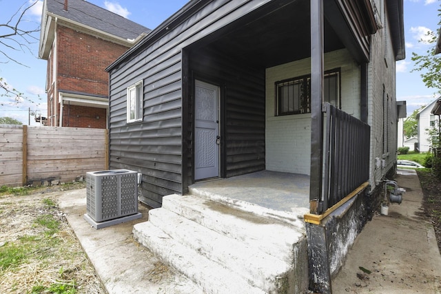 838 Wilson Ave, Columbus, OH 43206 - doorway to property featuring brick siding and central AC unit