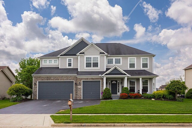 1923 Mallow Ln, Grove City, OH 43123 - view of front of property featuring driveway, a garage, and a front yard