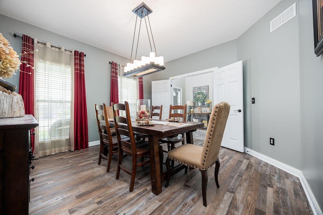1923 Mallow Ln, Grove City, OH 43123 - dining space featuring wood finished floors, baseboards, and a chandelier