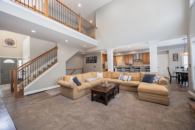 1923 Mallow Ln, Grove City, OH 43123 - living area with a towering ceiling, decorative columns, recessed lighting, baseboards, and stairs