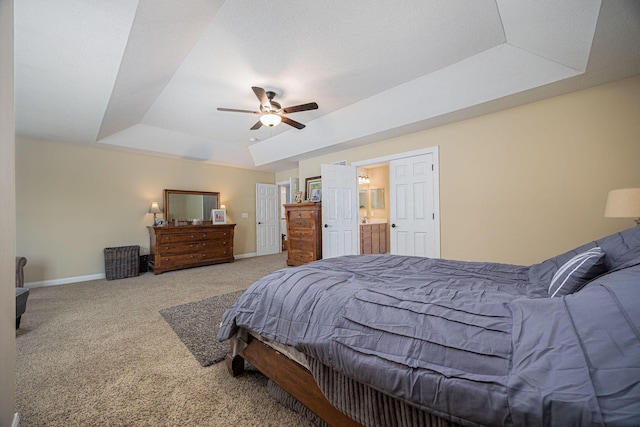 1923 Mallow Ln, Grove City, OH 43123 - carpeted bedroom featuring a tray ceiling, baseboards, and ceiling fan