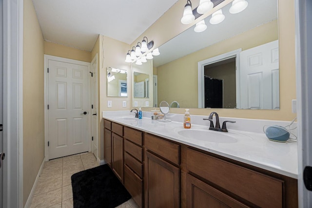 1923 Mallow Ln, Grove City, OH 43123 - bathroom with tile patterned floors, double vanity, and baseboards
