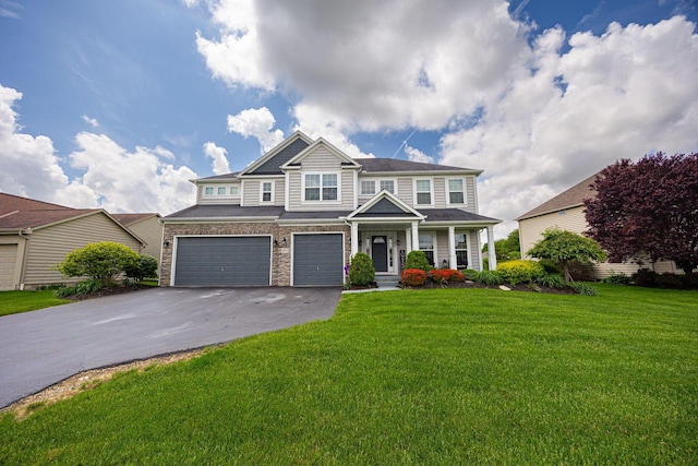 1923 Mallow Ln, Grove City, OH 43123 - view of front facade featuring driveway, an attached garage, a front lawn, and covered porch