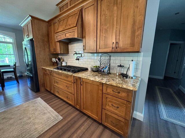 8610 Sadie Thomas Rd NW, Johnstown, OH 43031 - kitchen featuring black appliances, custom range hood, dark wood finished floors, and brown cabinetry