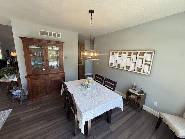 8610 Sadie Thomas Rd NW, Johnstown, OH 43031 - dining space with dark wood-style flooring, a chandelier, baseboards, and healthy amount of natural light